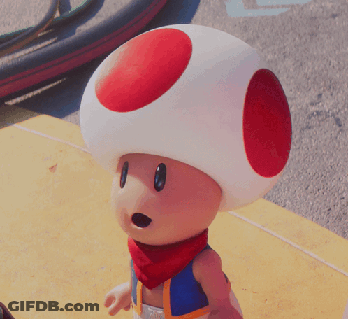 A Toad With A Red Circle On His Head And A Scarf Around His Neck GIF