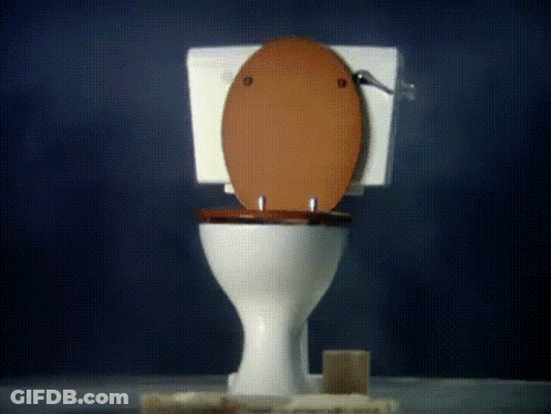 A Toilet With The Lid Up And A Soap Dispenser Next To It GIF