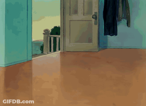 A Tom And Jerry Cartoon Shows A Cat Jumping In The Air GIF