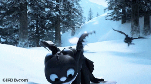 A Toothless Dragon Is Laying In The Snow With A Bird Flying In The Background GIF