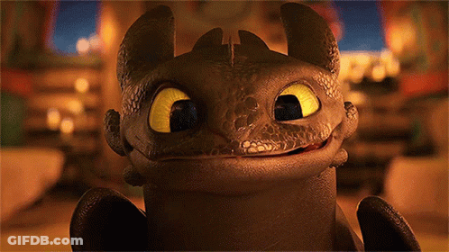 A Toothless From How To Train Your Dragon Is Smiling For The Camera GIF