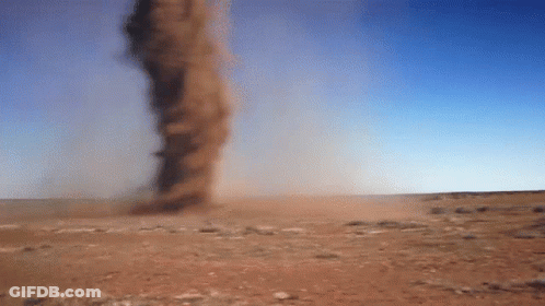 A Tornado In The Desert With A Blue Sky GIF