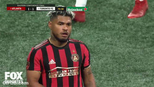 A Toronto Fc Soccer Player Stands On The Field GIF