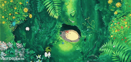 Sleeping Totoro In Forest Hole Surrounded By Flowers GIF