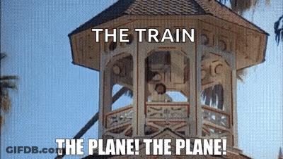 A Tower With The Words `` The Train The Plane ! The Plane ! '' Written On It . GIF