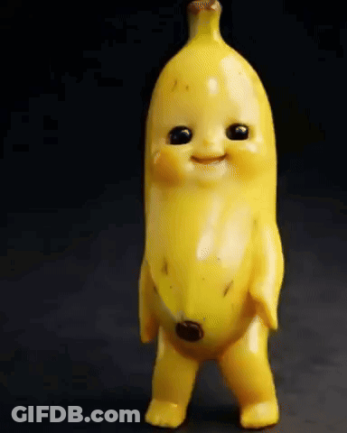 A Toy Banana With Black Eyes And A Smile On Its Face . GIF