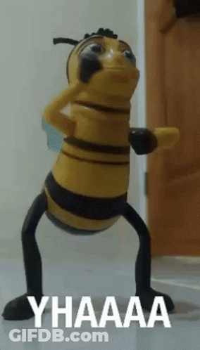 A Toy Bee Says Yhaaaa In White Letters On A White Surface GIF