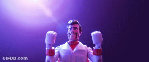 A Toy Figure With His Fist In The Air And A Beard GIF