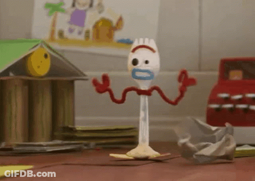 A Toy From The Movie Toy Story 4 Is Standing On A Wooden Floor . GIF