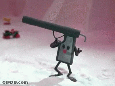 A Toy Gun With A Microphone Attached To It Is Walking In The Snow . GIF