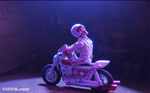 A Toy Motorcycle With A Maple Leaf On The Side Is Doing A Handstand GIF