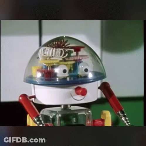 A Toy Robot With A Clear Dome On Top Of It 'S Head GIF