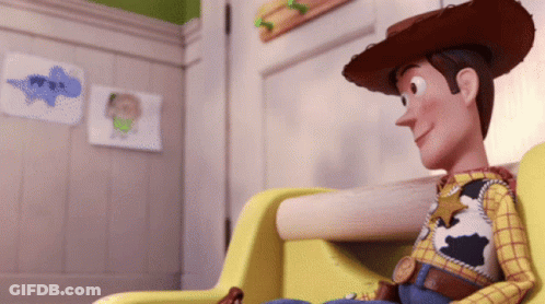 A Toy Story Character Is Sitting In A Chair GIF