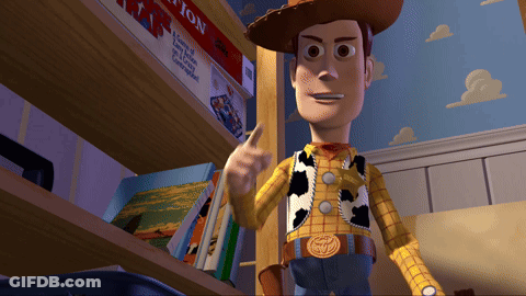 A Toy Story Character Is Standing In Front Of A Bookshelf GIF