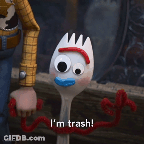 A Toy Story Character Says I 'M Trash In Front Of A Toy Fork GIF
