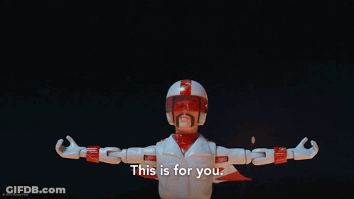A Toy Story Character Says " This Is For You " In Front Of Fireworks GIF