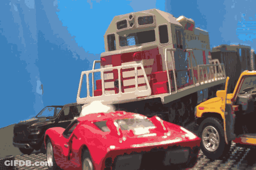 A Toy Train Has The Number 13E On The Side GIF