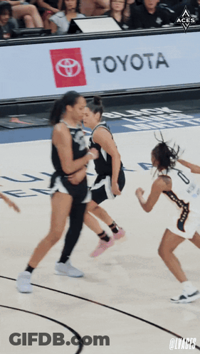 A Toyota Ad Is Behind A Basketball Game GIF