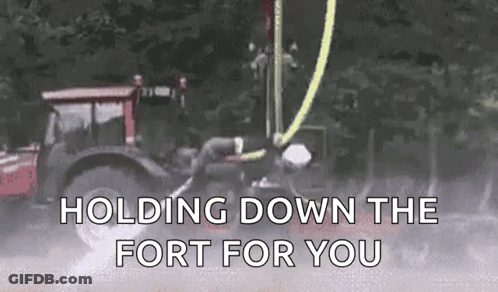 A Tractor Is Holding Down The Fort For You . GIF