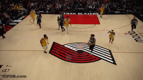 A Trail Blazers Basketball Game Is Being Played On A Basketball Court GIF