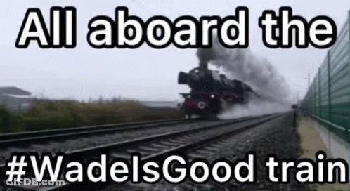 A Train Is Going Down The Tracks With The Words `` All Aboard The Wadels Good Train '' Written On It . GIF