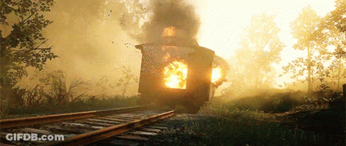 A Train Is On Fire On The Tracks With Smoke Coming Out Of It GIF