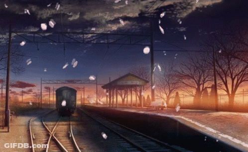 A Train Is Pulling Into A Train Station With A Sign That Says ' Aomori ' On It GIF