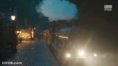 A Train That Has The Number 5972 On The Side Of It GIF