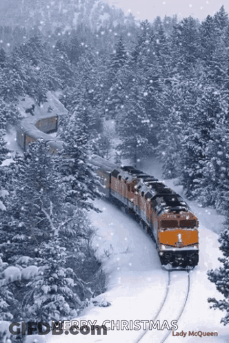 A Train Traveling Through A Snowy Forest With The Words Merry Christmas Written On The Bottom GIF