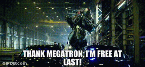 A Transformer Is Standing Next To A Car And Says Thank Megatron I 'M Free At Last ! GIF