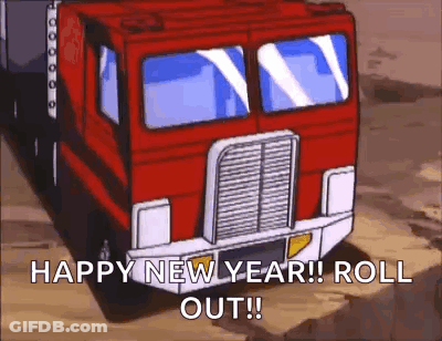 A Transformers Truck Is Driving Down A Dirt Road And Says `` Happy New Year ! Roll Out ! '' GIF