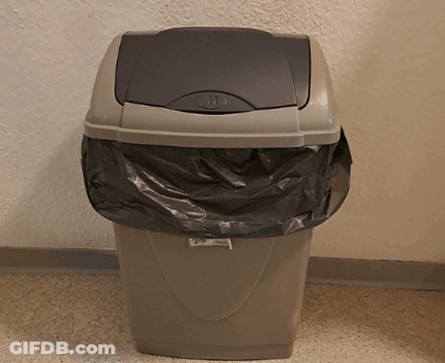 A Trash Can With A Black Bag In It And A Label That Says ' Recycling ' GIF