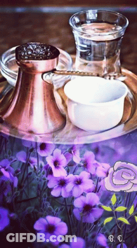 A Tray With Purple Flowers And A Glass Of Water GIF
