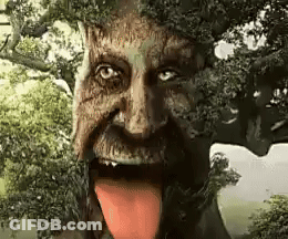 A Tree With A Man 'S Face And Tongue Sticking Out . GIF