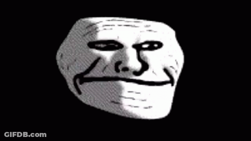 A Troll Face With A Smile On It 'S Face On A Black Background GIF