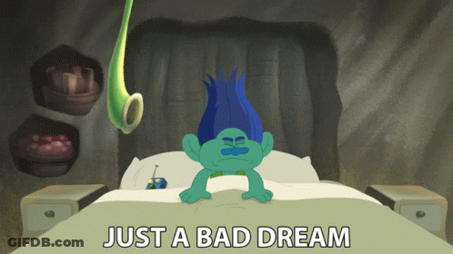 A Troll Laying On A Bed With The Words Just A Bad Dream Above Him GIF