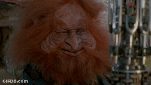 A Troll With A Beard Is Holding A Machine Gun GIF
