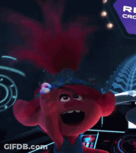 A Troll With A Crown On Her Head Is Sitting In Front Of A Crown Club Sign . GIF