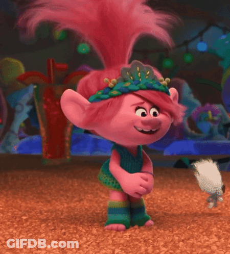 A Troll With Pink Hair And A Flower Crown On GIF