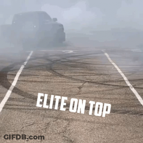 A Truck Is Drifting In A Parking Lot With The Words Elite On Top GIF