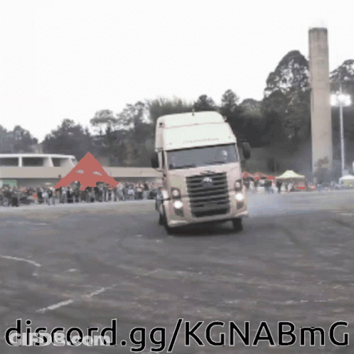 A Truck Is Driving Down A Road With The Words Discord.gg/kgnabmg Written Below It GIF