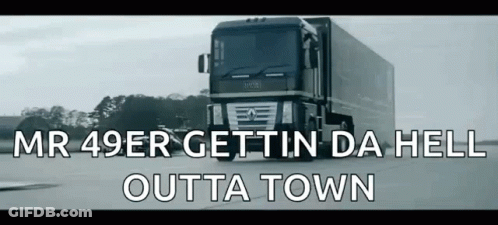 A Truck Is Driving Down A Road With The Words Mr 49Er Gettin Da Hell Outta Town Below It . GIF