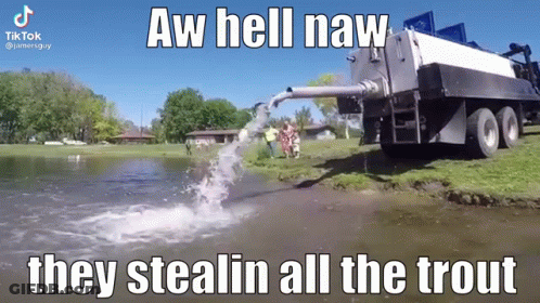 A Truck Is Pumping Water Into A Body Of Water . GIF