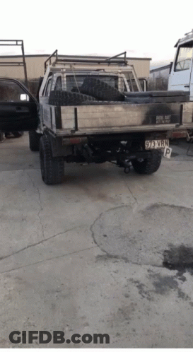 A Truck With A License Plate That Says 93 Vwp Is Parked In A Parking Lot GIF