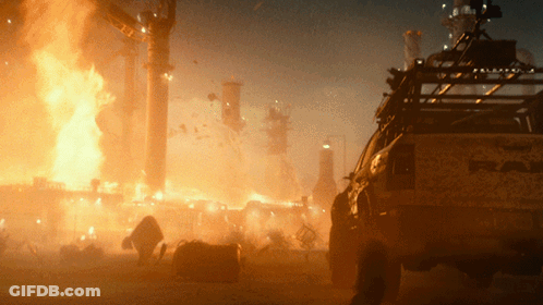 A Truck With The Word Raptor On The Back Is Parked In Front Of A Fire GIF