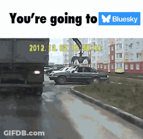 A Truck With The Year 2012 On The Back Is Driving Down A Street GIF