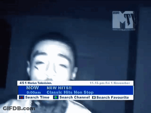 A Tv Screen Shows A Young Boy And Says " New Hits " On It GIF