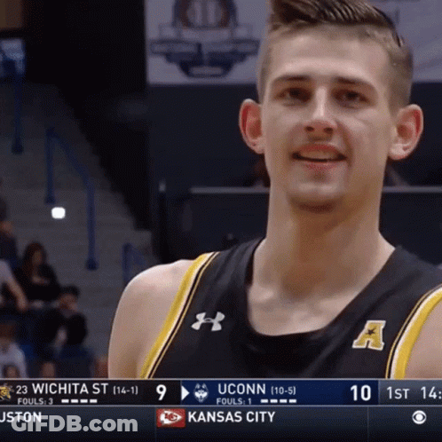 A Uconn Basketball Player Smiles During A Game Against Kansas City GIF