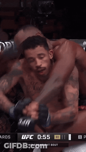 A Ufc Fight Is Underway With A Score Of 0:55 GIF