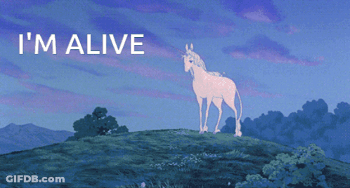 A Unicorn Standing On Top Of A Hill With The Words " I 'M Alive " Below It GIF
